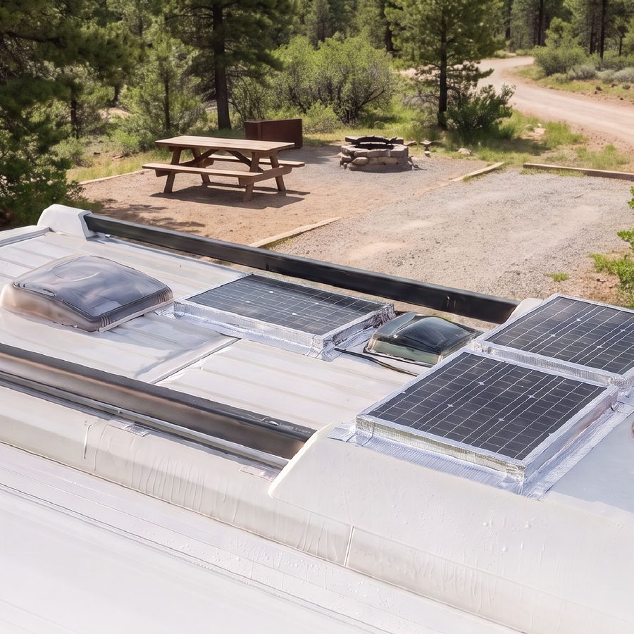 An RV roof with sealed seams around vents and solar panels